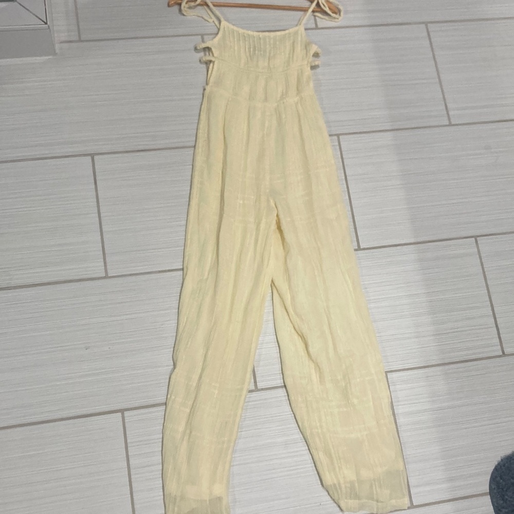 Yellow Urban Outfitters jumper, with open sides and tie straps.